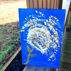 Dandelion blowing in the wind, making wishes